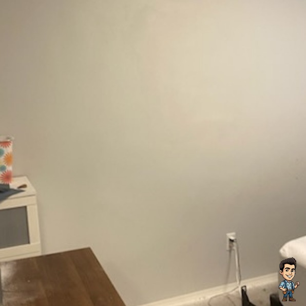Smooth repaired and painted bedroom wall after a large drywall patch